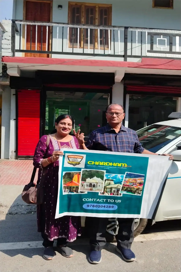 Couple at the start of their Yatra, posing in front of a hotel in Dehradun before beginning their Yamunotri Darshan
